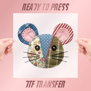 May include: A colorful mouse-shaped applique with patchwork design, featuring floral, plaid, and polka dot patterns. The mouse has button eyes and black whiskers. The text "READY TO PRESS" and "DTF TRANSFER" are visible.