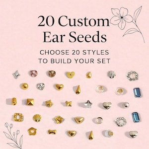 May include: An assortment of 20 custom ear seeds in various shapes and colors, including stars, hearts, and geometric designs. The text reads "20 Custom Ear Seeds" and "Choose 20 Styles to Build Your Set" on a pink background.