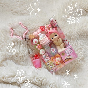 May include: A set of three ceramic mugs with a speckled, matte finish. The mugs are in shades of cream, light gray, and dark gray. Each mug has a simple, minimalist design, perfect for coffee or tea.