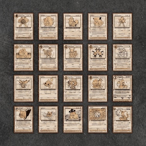 May include: Twenty wooden Pok&eacute;mon trading cards, each with a unique character illustration. The cards are laser-cut with detailed designs and text, featuring various Pok&eacute;mon from the popular franchise, presented on a dark surface.