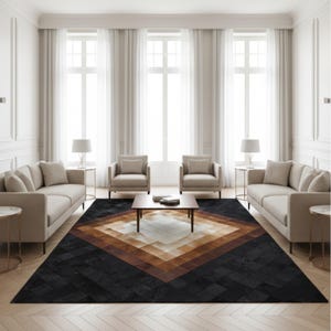 May include: A contemporary living room with a geometric rug in black, brown, and cream. The room is furnished with beige sofas, armchairs, and side tables with lamps. Large windows with white curtains provide ample natural light.