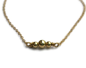 Gold layering necklace with 3 gold filled beads on dainty cable chain