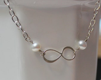 Infinity bracelet with pearls