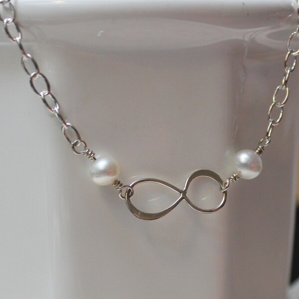 Infinity bracelet with pearls