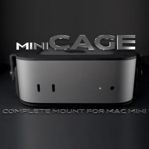 May include: A gray Mini Cage for Mac Mini, with the text "MINI CAGE" in silver above the device. The words "COMPLETE MOUNT FOR MAC MINI" are below the device. The device has two vertical slots and two circular openings.