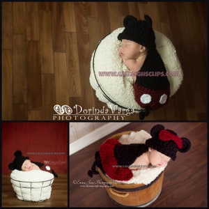 May include: A newborn baby wearing a black and red crocheted Mickey Mouse costume, sleeping in a white basket. The basket is on a wooden floor. The image includes the text "www.calleightsclips.com".