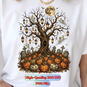 May include: A white t-shirt featuring a graphic of a large, dark, leafless tree with hanging lanterns, ghosts, and a full moon. The base of the tree is surrounded by orange pumpkins and gravestones. Text at the bottom reads High-Quality 300 DPI PNG File.