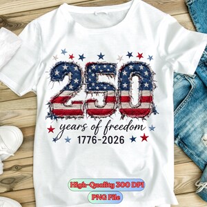May include: White t-shirt with a patriotic design. The number "250" is displayed in a denim-like texture with red and white stripes and blue stars. The text "years of freedom 1776-2026" is also present.
