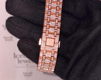 May include: A rose gold watch bracelet featuring a link design fully encrusted with small, clear, sparkling stones. The bracelet includes a rectangular clasp mechanism in the center and is displayed against a white background with Icecraft Jewels text.