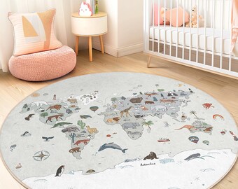 May include: A round, light gray rug featuring a world map design with illustrated animals and landmarks. The rug has a white border and is placed on a wooden floor. The map includes continents, oceans, and various animal illustrations.