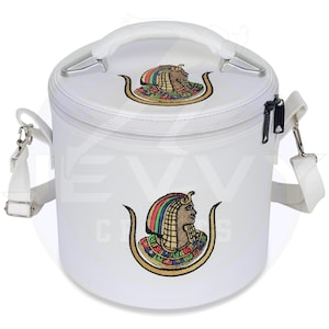 May include: White cylindrical cooler bag with a top handle and a detachable shoulder strap. The bag features two embroidered images of an Egyptian pharaoh with a colorful headdress. The bag has a zipper closure and silver-tone hardware.