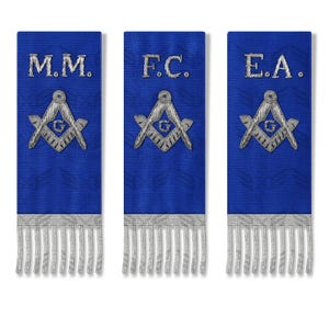 May include: Three blue Masonic sashes with silver embroidery and fringe. Each sash features a different set of initials: M.M., F.C., and E.A. The sashes display the Masonic square and compass symbol.