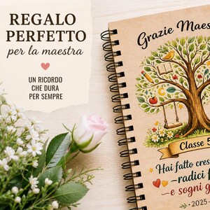 May include: A spiral-bound notebook with a wooden cover featuring a tree illustration with swings, apples, and a globe. The notebook has text in Italian, a pen, and a pink rose are next to it. The notebook is a gift for a teacher.