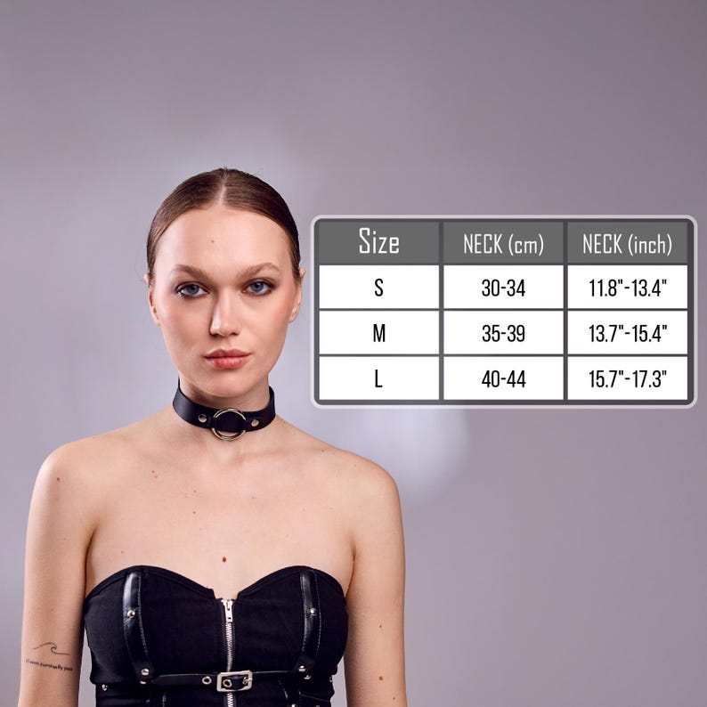 May include: A black leather choker with a silver ring detail. The image includes a size chart with neck measurements in centimeters and inches: S (11.8"-13.4"), M (13.7"-15.4"), and L (15.7"-17.3").