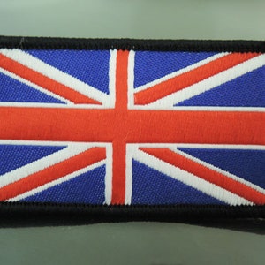 May include: A blue, red, and white embroidered Union Jack flag patch with a black border.