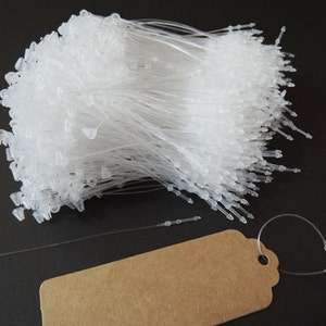 1000pcs Clear White Snap Lock Tag String Clothing Tag String Hang Tag String 80mm afbeelding 1