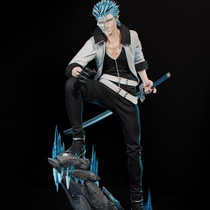 May include: A detailed figurine of a character with spiky blue hair, wearing a white jacket, black pants, and holding a sword. The figure stands on a rocky base with blue crystal accents, set against a black background.