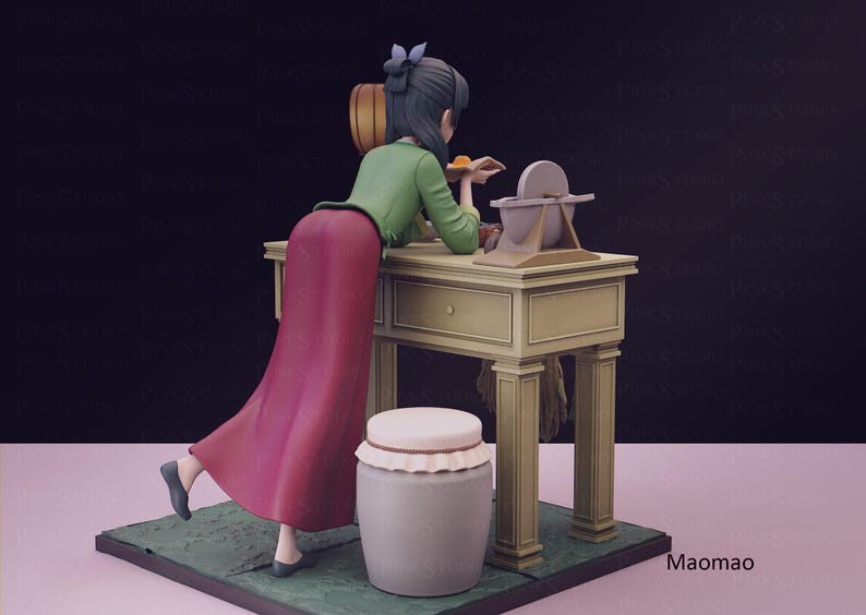 May include: A figurine of a woman in a long red skirt and green top, leaning on a beige table. A grinding wheel and a jar with a lid are next to the table. The figurine is on a green base.