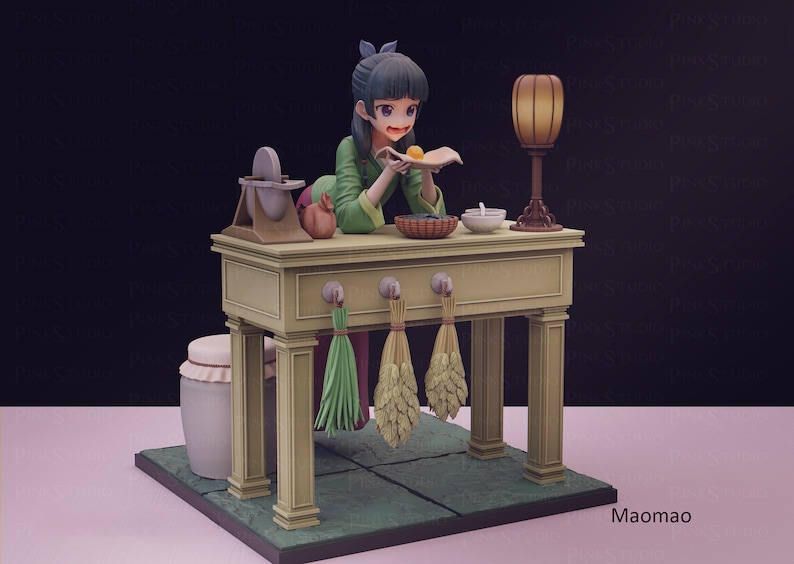 May include: A detailed figurine of a woman in a green outfit, preparing food at a table. The table has a lamp, a bowl, and a basket. Decorative bundles hang below the table. The base is green with a tile pattern.