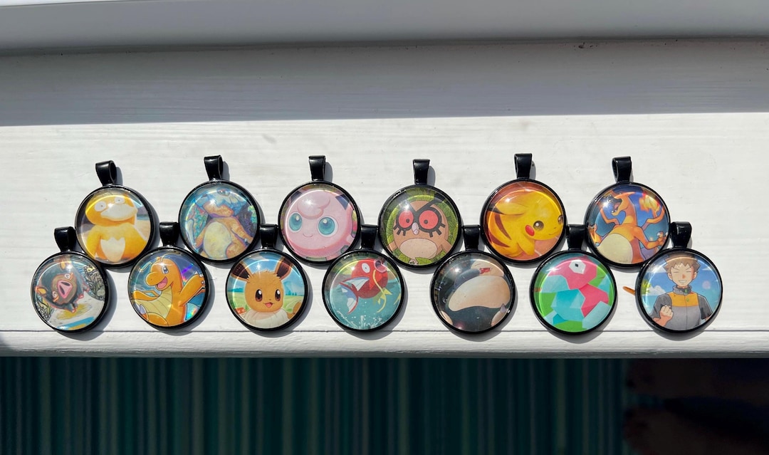 pokemon card necklace Clasp Slab Holder Necklace: Deepspace Black Meowth charm measures about 1 inch. Logan Paul sells Pokmon card
