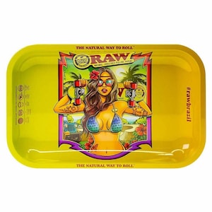 May include: Yellow rectangular rolling tray with rounded corners. The tray features a graphic of a woman in sunglasses holding rolling papers. Text includes "RAW" and "The Natural Way to Roll." The hashtag "#rawbrazil" is on the right side.