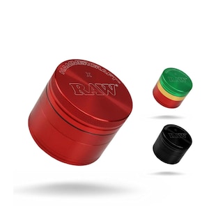 May include: Red, green, and black metal grinders with the text "RAW" and "HAMMERCRAFT" on the lids. The red grinder is the largest, with a textured edge. The green grinder has a gold band, and the black grinder is the smallest.