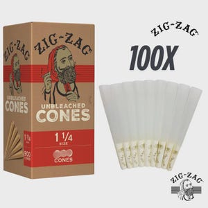 May include: A box of Zig-Zag unbleached cones with the text "1 1/4 SIZE" and "900 CONES". Next to the box are 100 white cones. The Zig-Zag logo is visible on the box and the cones.