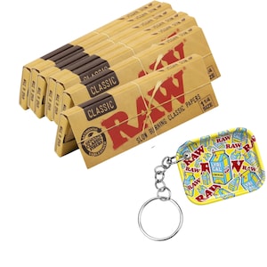 May include: A collection of RAW Classic rolling papers and a small, yellow keychain tray. The rolling papers are in tan packaging with red text, and the keychain tray has a colorful lemonade design.