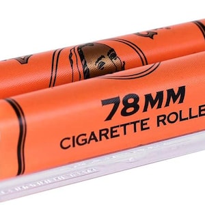 May include: A clear plastic 78mm cigarette roller with two orange rollers. The orange rollers have black text that reads "78MM CIGARETTE ROLLER". The rollers also have a graphic of a person's face.