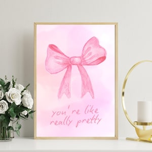 Arte de pared con lazo de cinta rosa