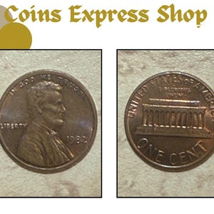 Puede incluir: Dos monedas de centavo estadounidenses de color cobre. Una moneda muestra el perfil de Abraham Lincoln y el año 1982. La otra moneda muestra el Lincoln Memorial y las palabras "ONE CENT". El texto "Coins Express Shop" está en la parte superior.