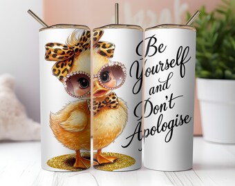May include: A white tumbler with a cartoon chick wearing sunglasses, a bow, and a bow tie, all with a leopard print design. The tumbler has the text "Be Yourself and Don't Apologize."