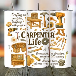 May include: A white tumbler with a stainless steel straw, featuring a watercolor design of carpentry tools and the words "CARPENTER LIFE." The design includes a hammer, saw, drill, and other tools, with text that reads "Crafting with precision, building with passion."