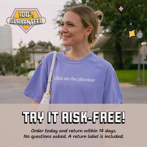 A woman wearing a purple t-shirt with the text "dibs on the plumber" is smiling and looking to the side. The image appears to be a promotional graphic for a product or service, with a "100% GUARANTEED" sign above it and a "TRY IT RISK-FREE!" message below.