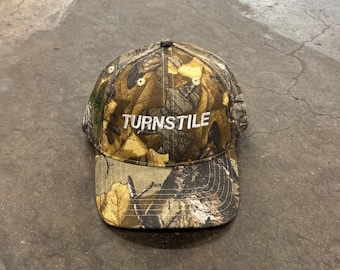 Gorra de camionero de camuflaje Turnstile