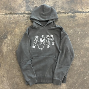 May include: A dark grey hoodie with a drawstring hood and a front pocket. The front displays a white graphic of cartoon figures. The hoodie is made of a soft, comfortable material.