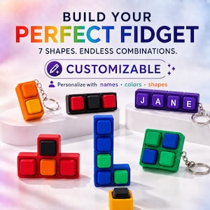 May include: A collection of customizable fidget toys in various geometric shapes and colors, including orange, red, black, purple, green, and blue. Some feature keychains. Text reads: BUILD YOUR PERFECT FIDGET, 7 SHAPES. ENDLESS COMBINATIONS. CUSTOMIZABLE, Personalize with names, colors, shapes. The purple toy displays the name JANE.