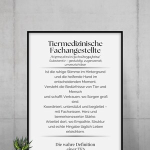 May include: A black framed print with German text, including the words "Tiermedizinische Fachangestellte". The print is displayed with a small potted plant in front of it.