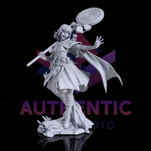 May include: A gray figurine of a woman holding a large lollipop. She is wearing a dress, cape, and boots. The figurine is standing on a rock base. The word "AUTHENTIC" is printed on the base.