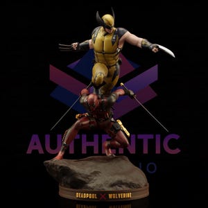 May include: A detailed statue featuring Deadpool and Wolverine in action poses. Deadpool is in a red and black suit, wielding swords, while Wolverine is in a yellow and black suit with claws extended. The base reads "DEADPOOL X WOLVERINE".