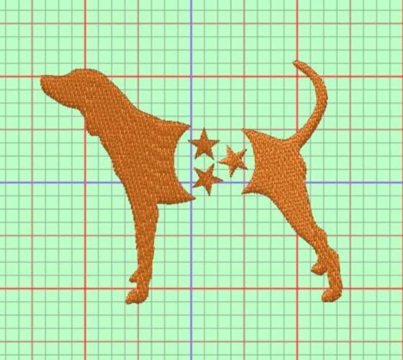 May include: An orange embroidered design of a dog with three stars on a green grid background. The dog's body is segmented into three parts. The design is likely for embroidery or a similar craft project.