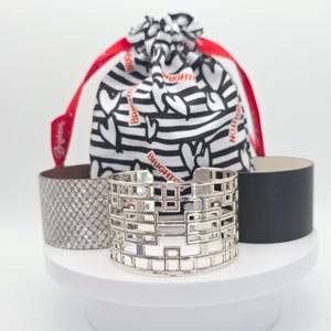 May include: A rustic wooden sign with the text "Welcome to our home" in white lettering. The sign features a distressed finish and a simple, inviting design, perfect for front door decor.