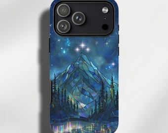 May include: A smartphone case featuring a stained-glass style mountain landscape at night. The design displays a jagged blue mountain peak, dark pine trees, and a reflective lake under a starry sky with three bright stars at the top center.