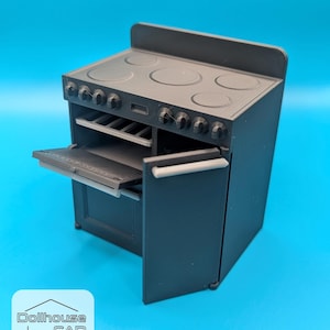 May include: A miniature gray stove with an open oven door and a stovetop with four burners. The stove has knobs and a handle. The image includes the text "Dollhouse CAD".
