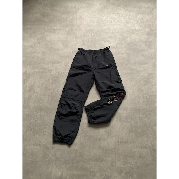 black nike joggers red logo
