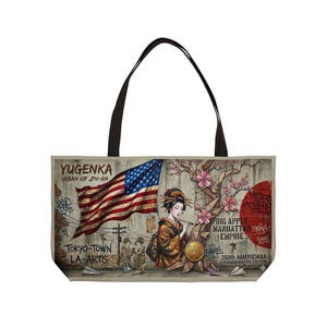 May include: A tote bag featuring a graphic print of a geisha standing before a waving American flag and a stylized tree with pink blossoms. The design includes graffiti-style text reading YUGENKA, TOKYO-TOWN, LA-ARTS, and BIG APPLE MANHATTAN EMPIRE.