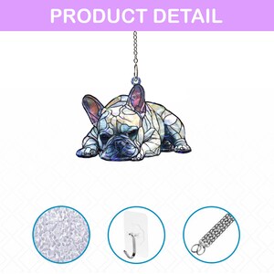 May include: A decorative hanging ornament featuring a French Bulldog in a stained-glass style design. The dog is lying down with its head resting on its paws. The ornament hangs from a silver chain. The text "PRODUCT DETAIL" is at the top.