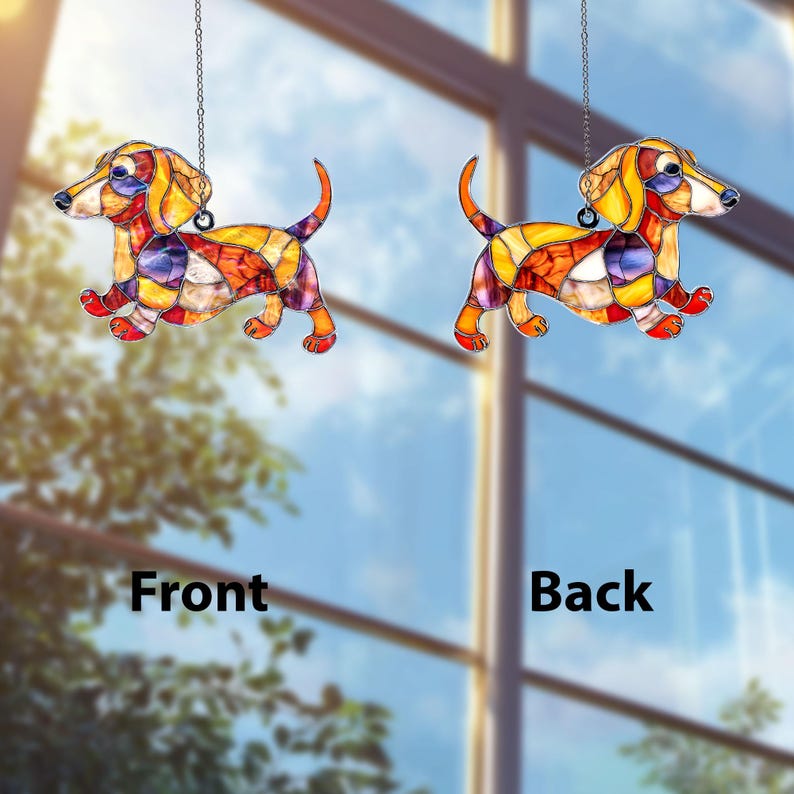 May include: Two stained glass dachshund ornaments, one labeled "Front" and the other "Back". The dogs are in a running pose, with colorful patchwork designs in shades of yellow, orange, red, purple, and blue. Each ornament hangs from a silver chain.