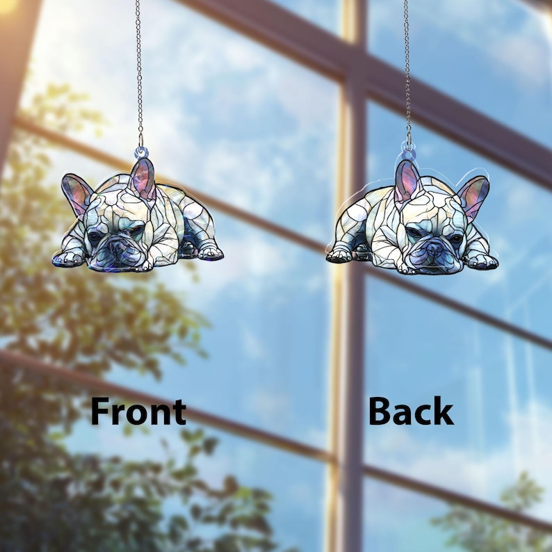 May include: Two hanging French bulldog ornaments. Each ornament is a stylized depiction of a French bulldog in a resting pose, with a stained-glass effect. The front and back of the ornament are visible, with the words "Front" and "Back" displayed.