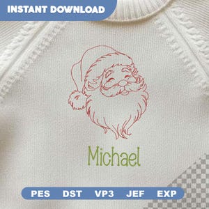Pode incluir: Um tecido branco texturizado com um contorno bordado a vermelho de um rosto de Pai Natal com gorro e barba. Abaixo do bordado, o nome Michael está cosido com fio verde. O texto INSTANT DOWNLOAD e os formatos de ficheiro são visíveis.